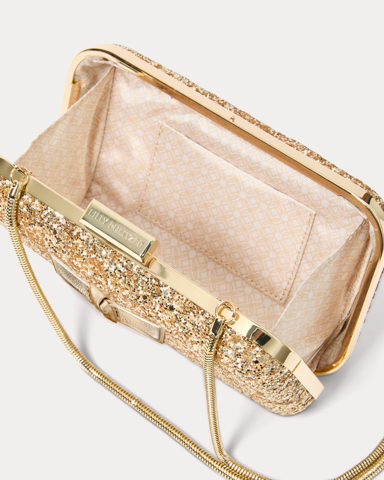 Wanda Bow Glitter Clutch In Gold Metallic