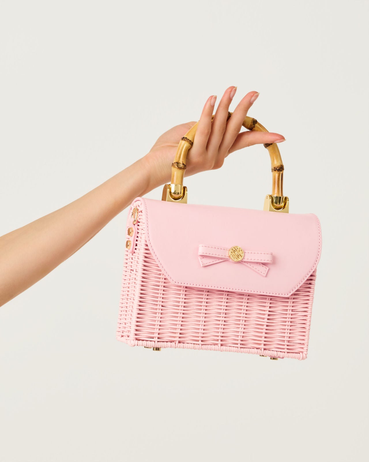 Teighen Bow Wicker Bag In Pink Muse