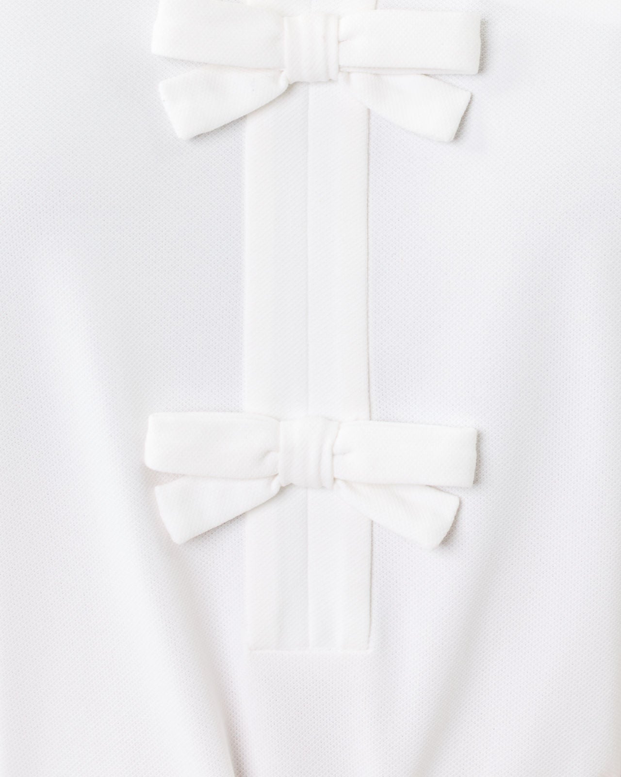 Frida Sleeveless Bow Polo In Resort White
